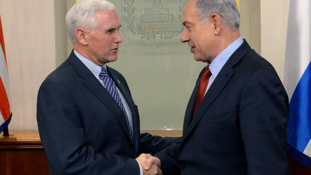 JERUSALEM, ISRAEL - DECEMBER 29:  (ISRAEL OUT) In this handout provided by the Israeli Government Press Office, Israel Prime Minister Benjamin Netanyahu (R) shakes hands with Indiana Governor Michael Pence  as they meet  December 29, 2014 in Jerusalem, Israel. (Photo by Amos Ben Gershom /GPO via Getty Images)